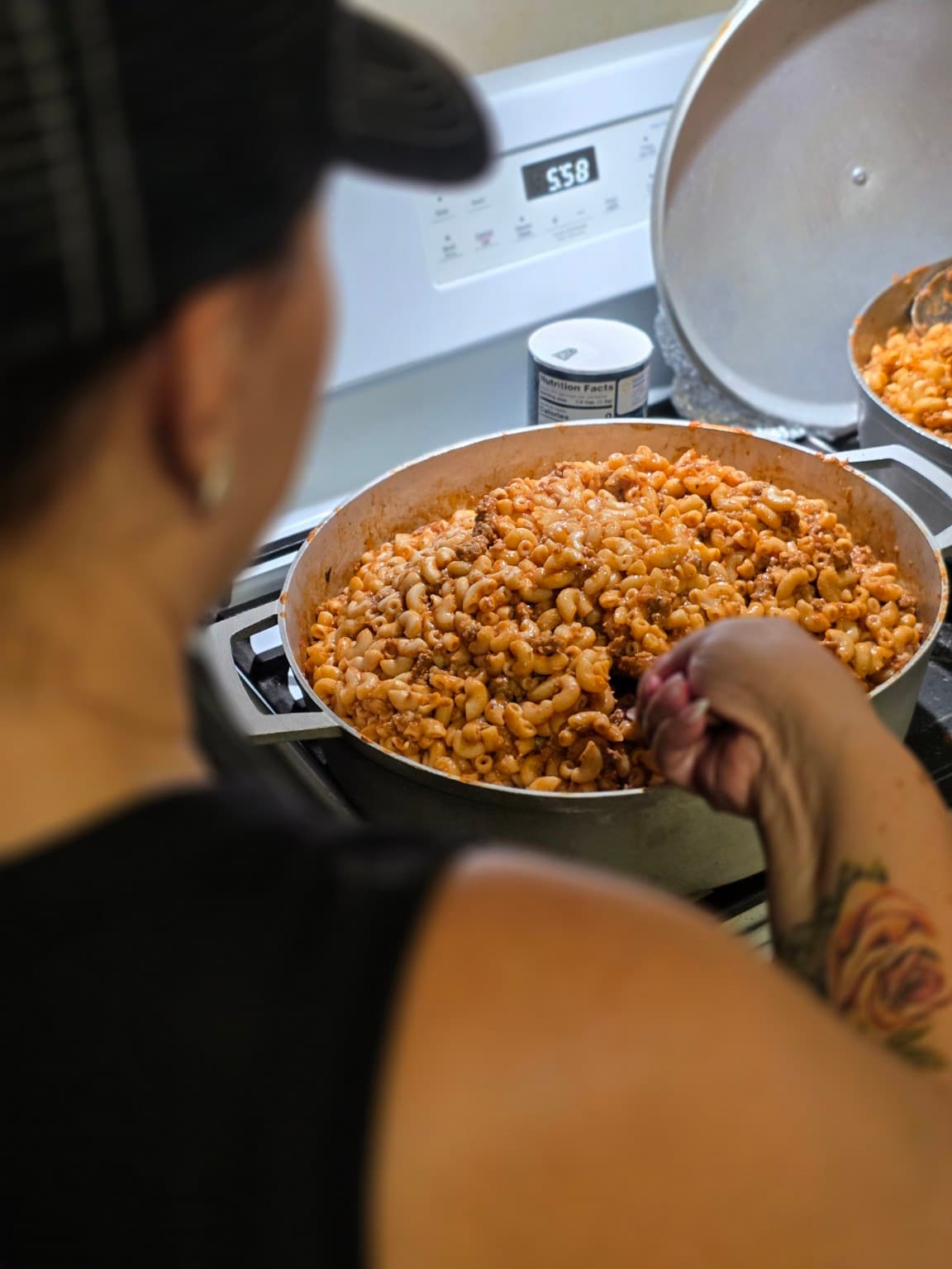 A ONE1SIX volunteer preparing hot food