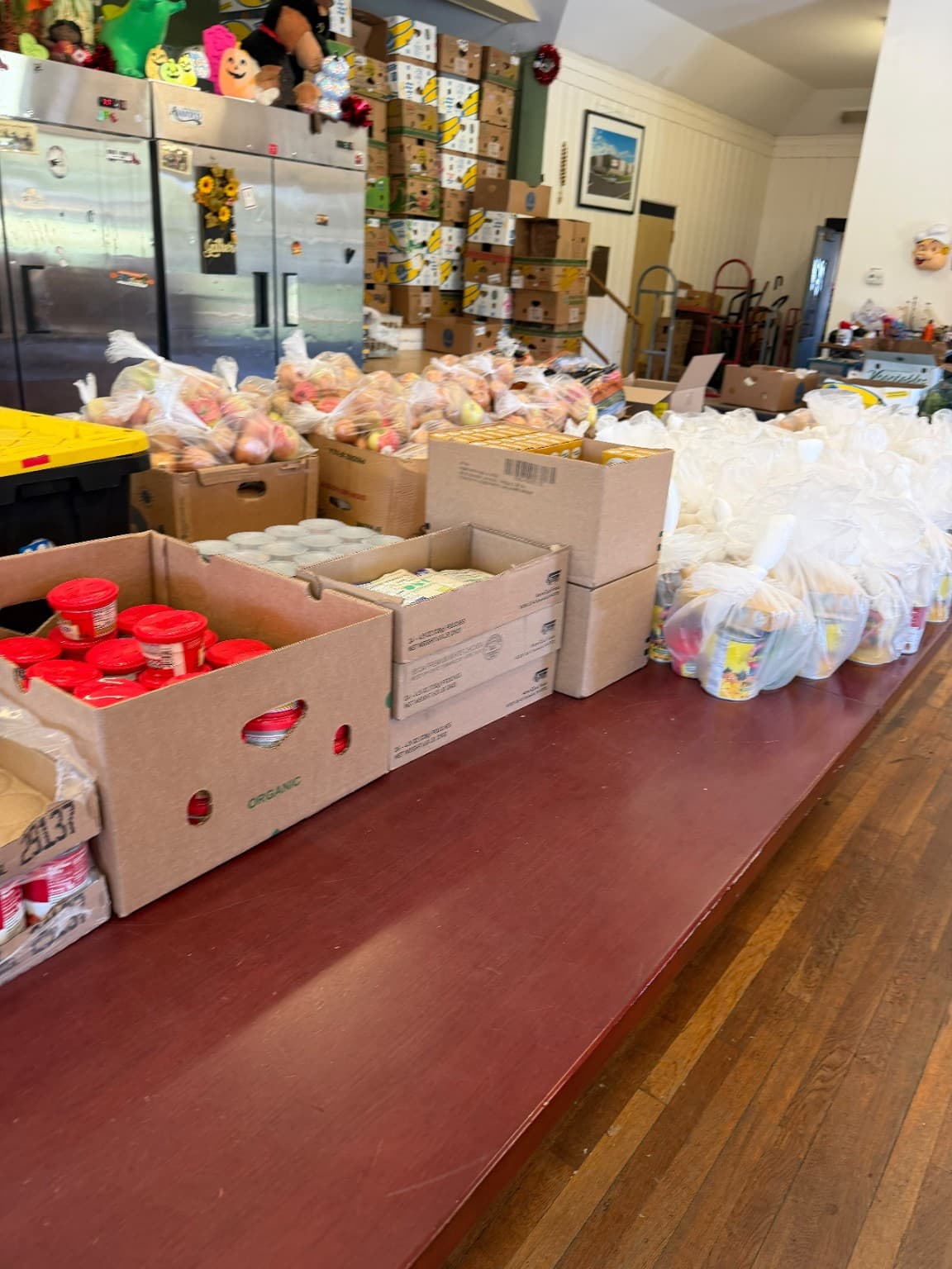 Boxes of food and prepared grocery bags at South Worcester Neighborhood Improvement Center